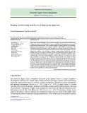 Designing a location-routing model for cross docking in green supply chain