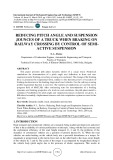 Reducing pitch angle and suspension jounces of a truck when braking on railway crossing by control of semi-active suspension